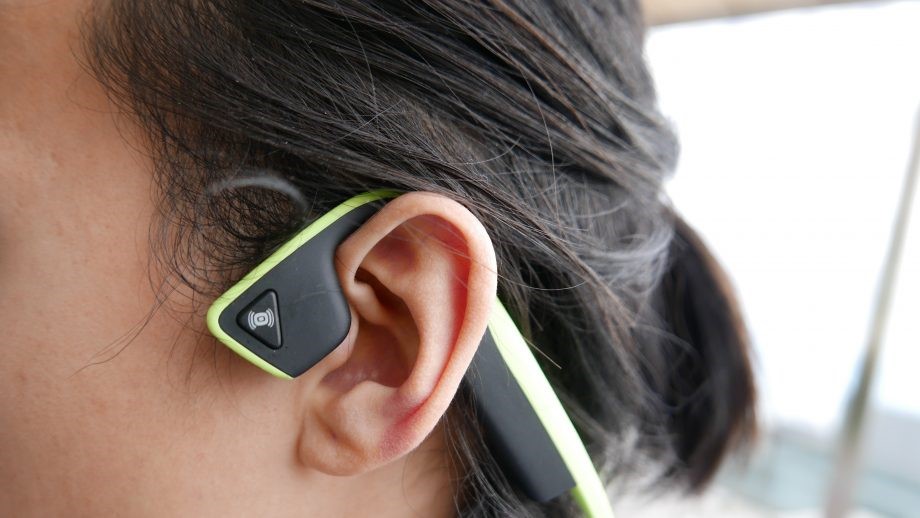 Image of a person wearing a set of bone conducting headphones