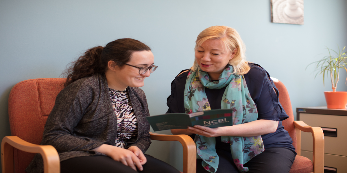 Image of Aoife and her instructor reading Vision Ireland's leaflet