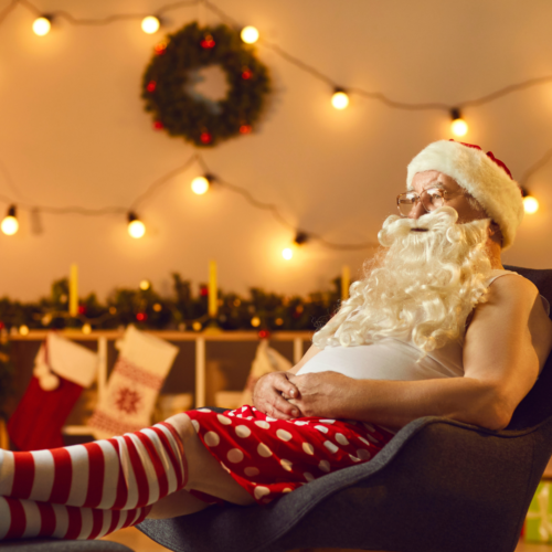 Santa in his underwear relaxing watching TV