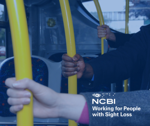 Hands holding yellow bus poles with the Vision Ireland logo, working for people with sight loss