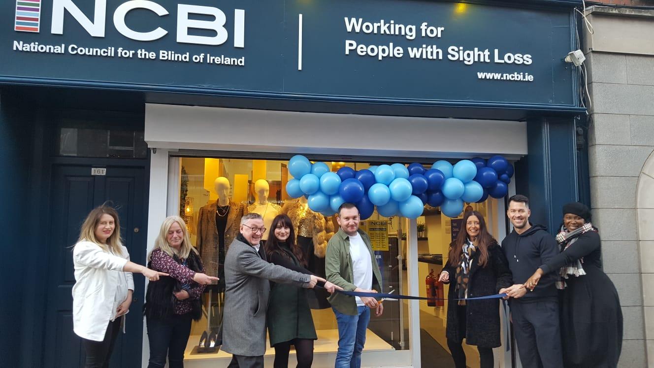 Vision Ireland CEO, Chris White, and Vision Ireland Head of Retail, Beverley Scallan, alongside Vision Ireland volunteers and staff as they cut the ribbon to open the new Vision Ireland shop on Capel Street in Dublin