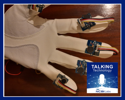 Jedi Glove prototype - white with black sensors at fingertip with Talking Technology Logo