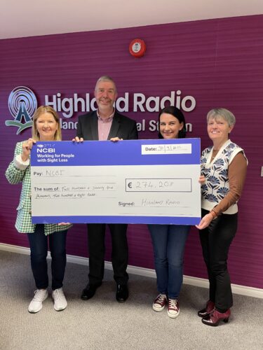 Joanne McCarney, Vision Ireland Fundraising Executive, and Danny Cahill, Vision Ireland National Services Manager for the Adult Team, accept a cheque for Vision Ireland for over €270,000 from the team at Highland Radio Bingo.
