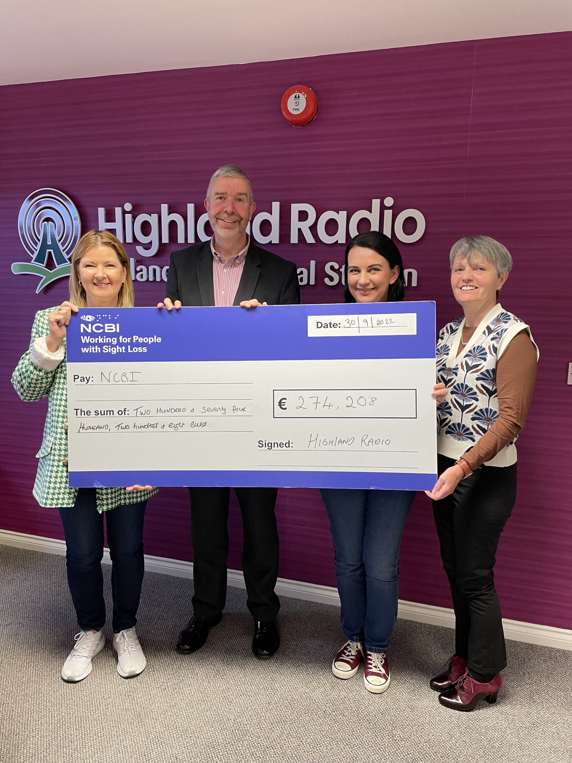 Joanne McCarney, Vision Ireland Fundraising Executive, and Danny Cahill, Vision Ireland National Services Manager for the Adult Team, accept a cheque for Vision Ireland for over €270,000 from the team at Highland Radio Bingo.