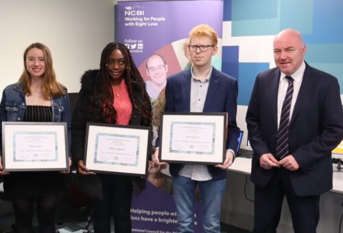 Maya Flynn, Rafiat Agbona and Jack Spillane accept their Gerard Byrne Bursary certificates from John Kearney, NCSE CEO, during a presentation at Vision Ireland's offices in Tallaght.