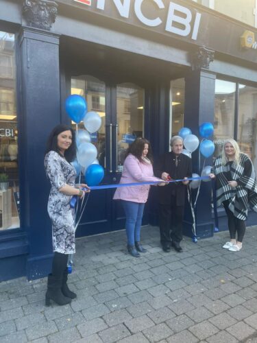 Former Lord Mayor of Fermoy, William Hughes, cuts the ribbon to open Vision Ireland Fermoy's new location alongside Helen White, Elaine Williams, area manager of Vision Ireland Fermoy (right) and Vision Ireland Fermoy store manager, Laura Nolan (left).