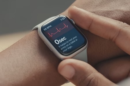 Wrist with Apple watch displaying ECG feature