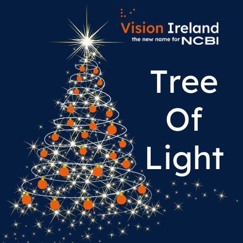 A Christmas tree figure made from bright white lights which also have orange baubles hanging from it. The tree is against a navy background and the Vision Ireland logo is in the top right of the image. Under this reads: Tree of Light.